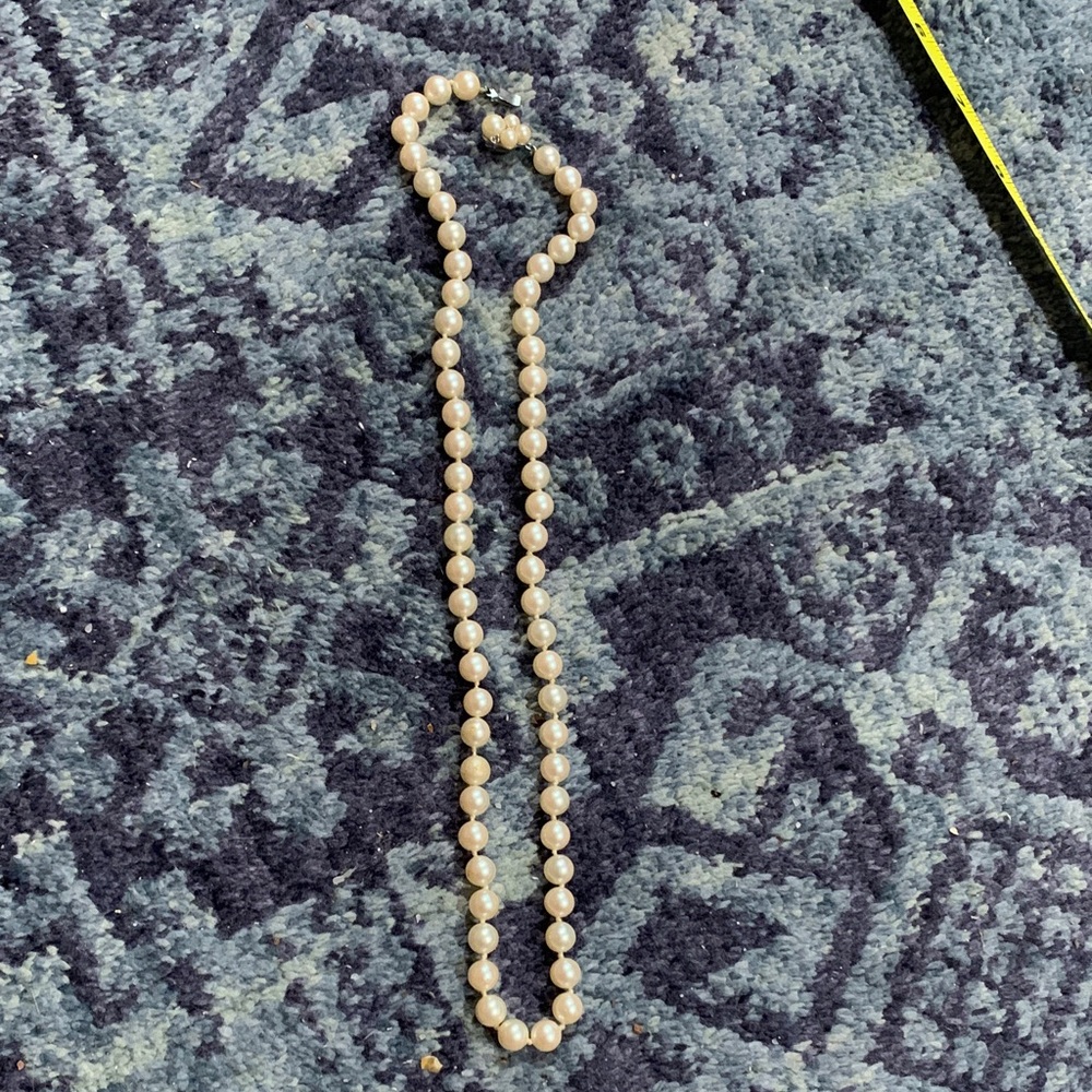 Vintage ivory hand knotted 22” pearl necklace w a few imperfections, as pictured